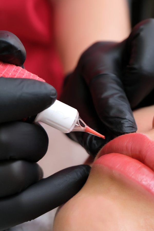 Close up of permanent lip makeup Close up of permanent lip makeup. lip tattoo. Beautiful lips